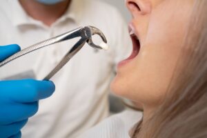 Woman getting a tooth removed